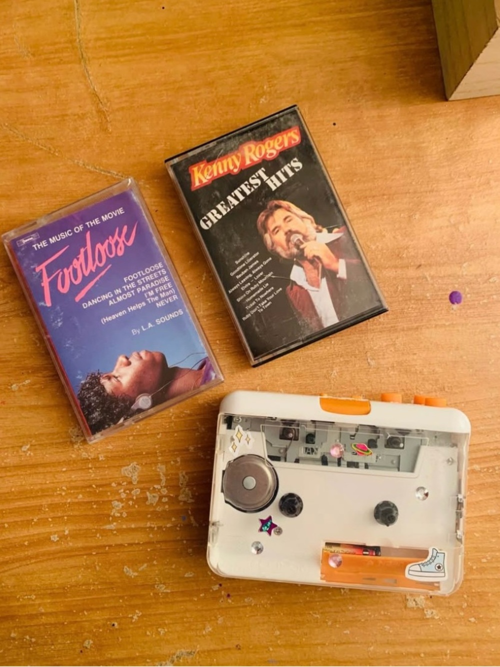 White and Orange Portable Cassette Player with Decorative Accents 🖤